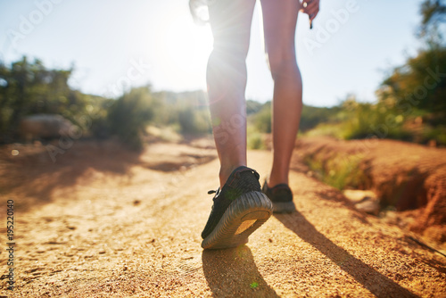 hiker walking on dirt path close up on shoes while walking