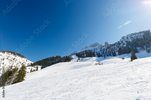 Ski slope at Mountain Kampenwand on sunny winter day