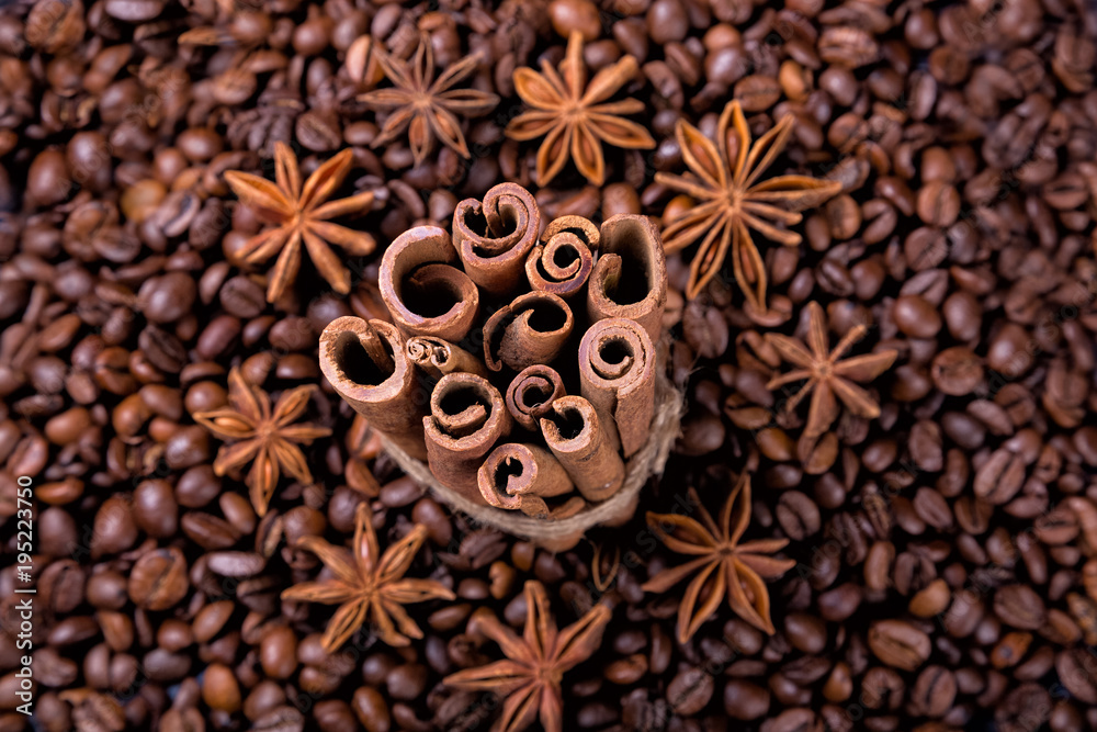 Coffee beans and cinnamon on a background of burlap. , Coffee beans and cinnamon on a background of burlap. ,