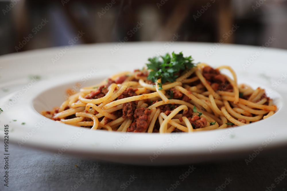Spaghetti bolognese with beef tometo sauce on wood table , italian food