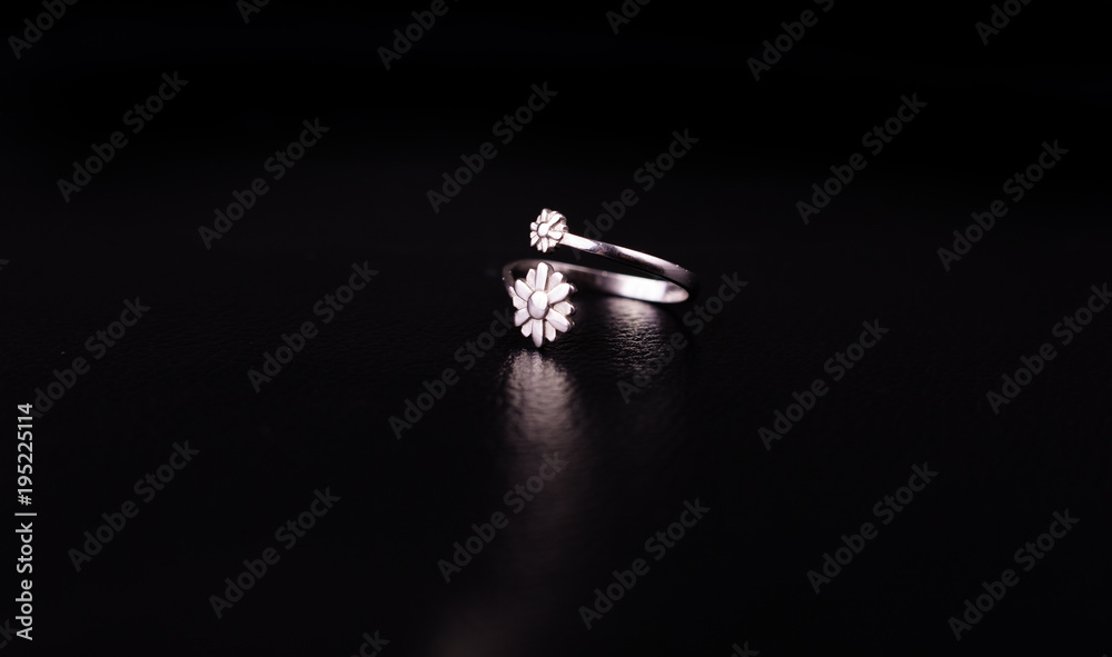 Fine silver jewelry on a black background with copy space Fine silver jewelry on a black background with copy space