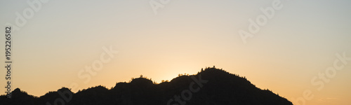 panoramic landscape image of cactuss covered hills in Argentina at sunrise