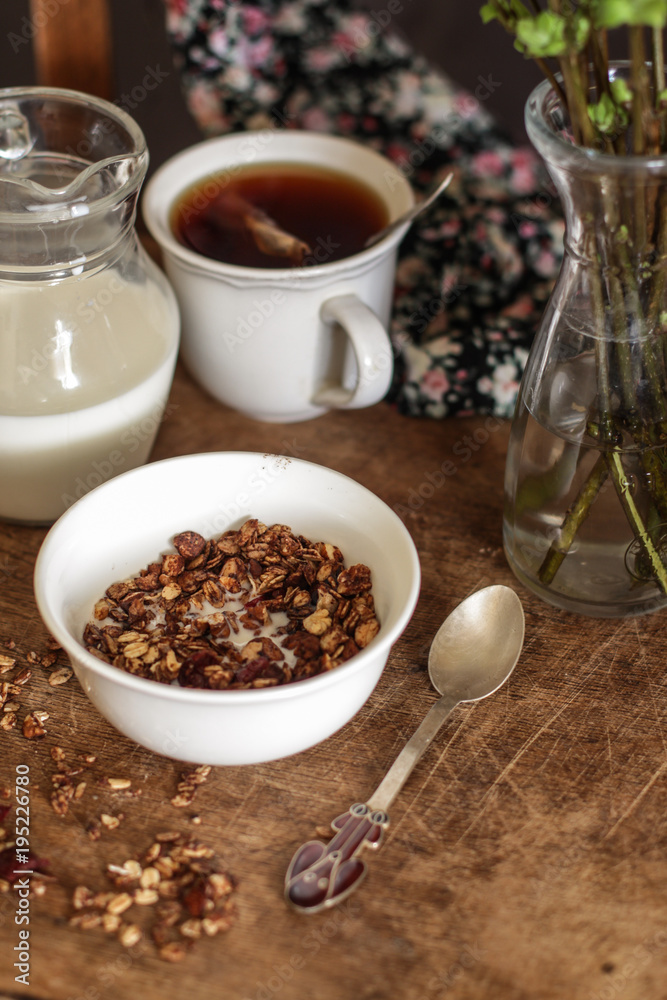 Breakfast granola with milk, cookies. Tasty and healthy food Breakfast granola with milk, cookies. Tasty and healthy food