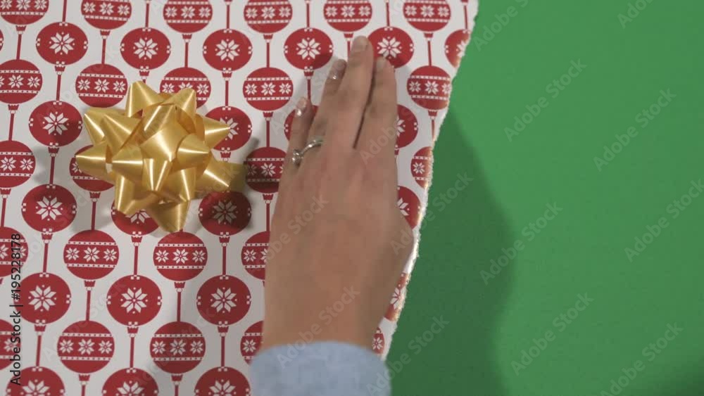 Ripping a Christmas wrapping paper
