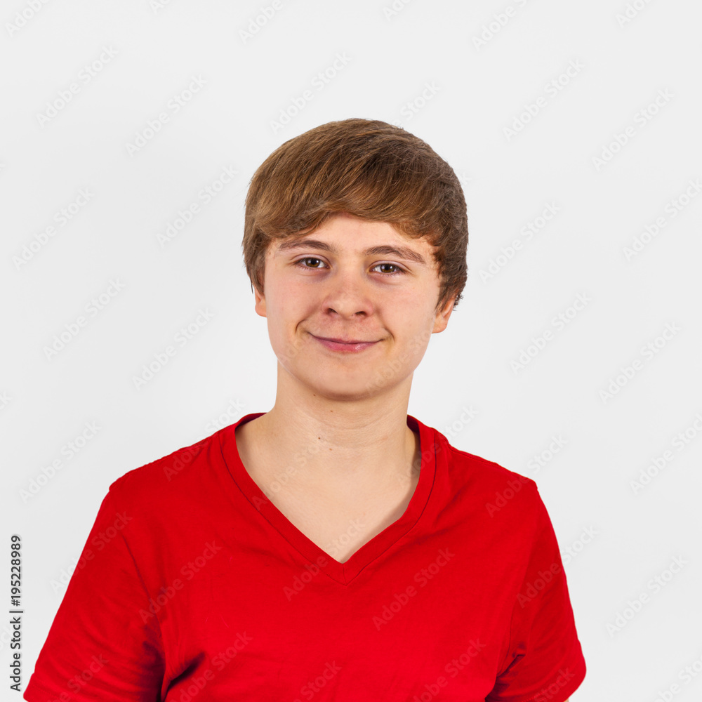 smiling teenage boy with red shirt isolated on white smiling teenage boy with red shirt isolated on white