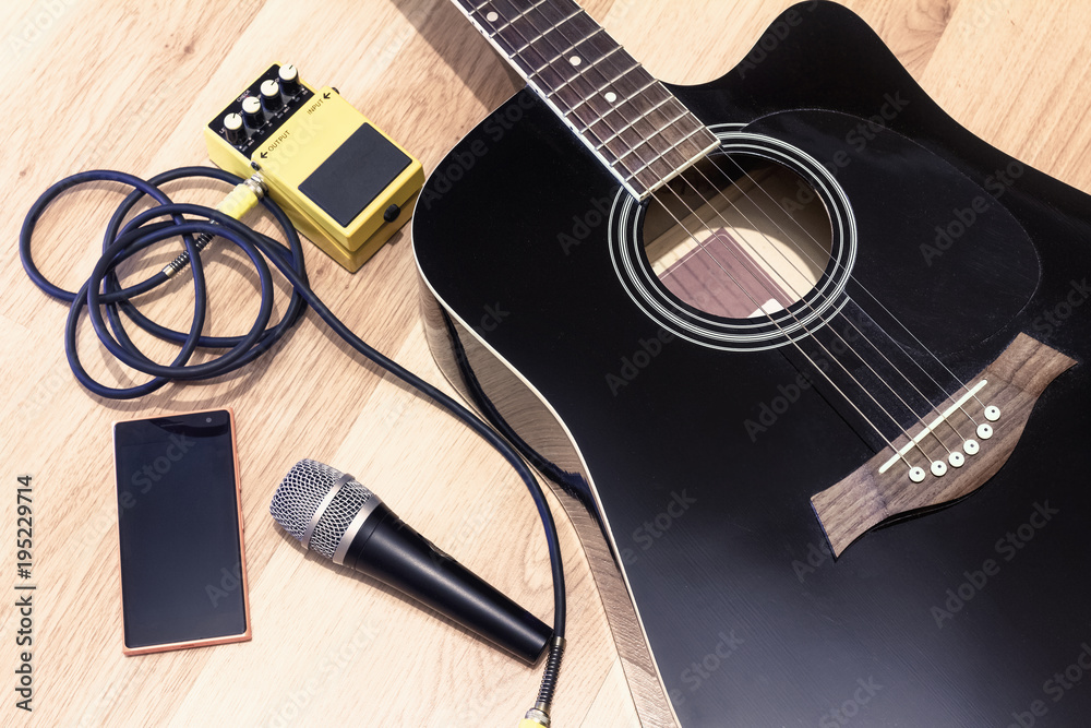 Naklejka premium Set of music objects with black accoustic guitar