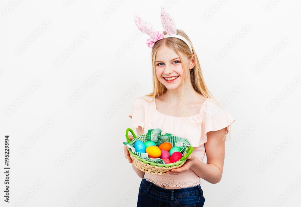 Teenage girl holding Easter eggs Teenage girl holding Easter eggs