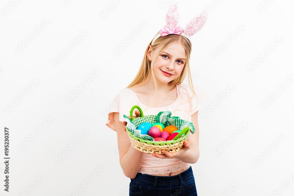 Teenage girl holding Easter eggs Teenage girl holding Easter eggs