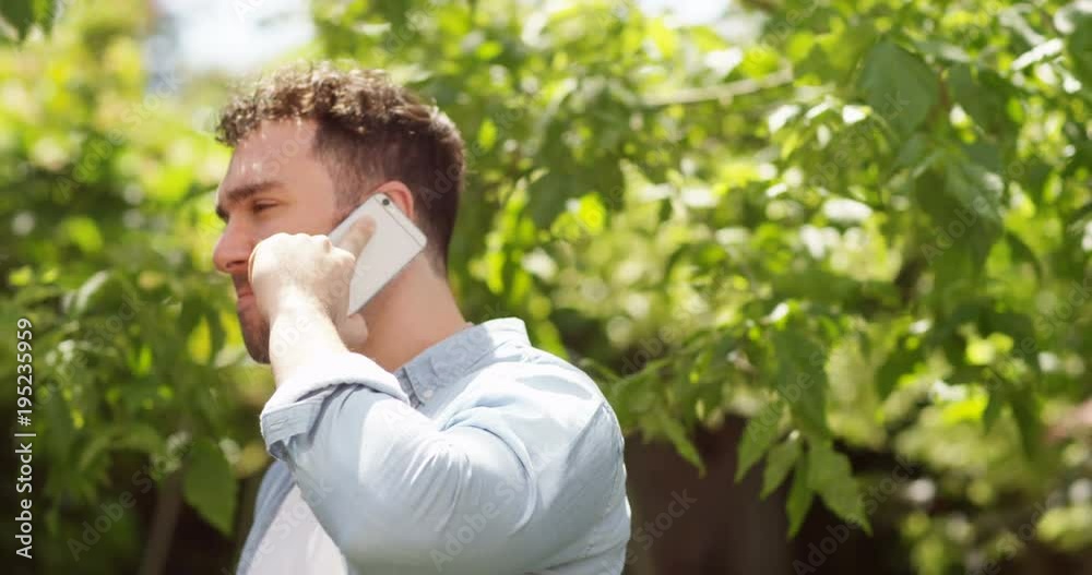 4K Happy man in new relationship making flirty phone call to a loved one outdoors. Slow motion. 4K Happy man in new relationship making flirty phone call to a loved one outdoors. Slow motion.