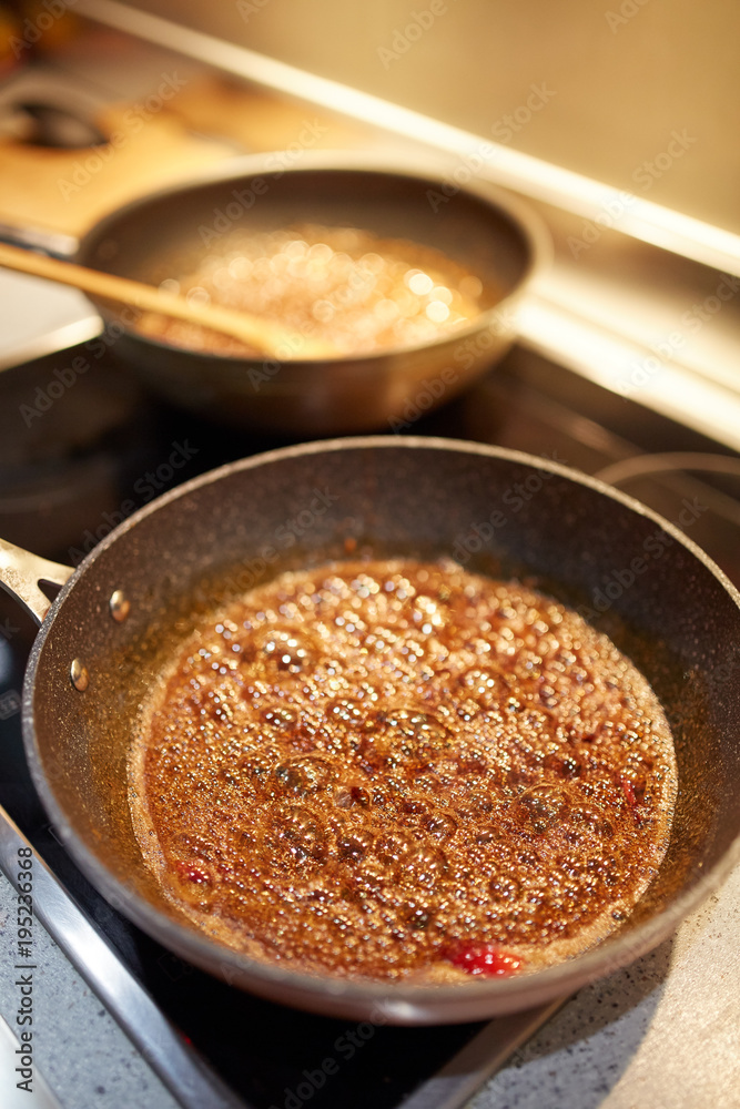 Brown sugar caramelizing in a pan Brown sugar caramelizing in a pan