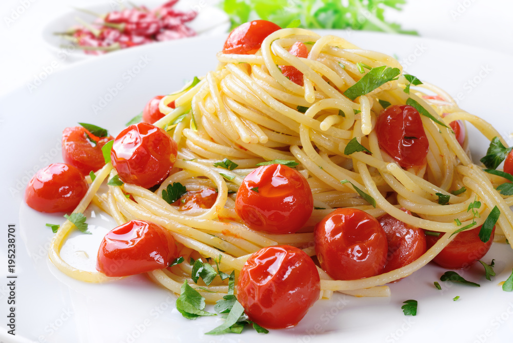 Pasta with cherry tomatoes, garlic, oil, chilli pepper and parsley Pasta with cherry tomatoes, garlic, oil, chilli pepper and parsley