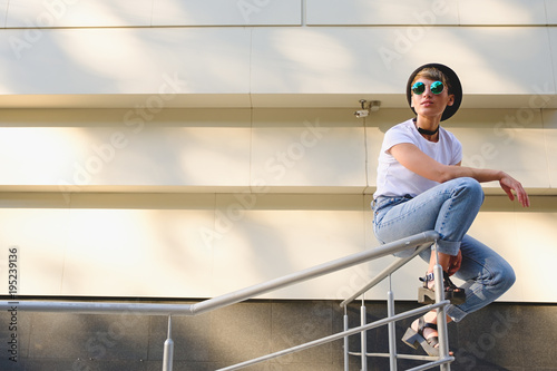 Modern woman portrait wearing stylish round glasses hanging out