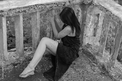 Beautiful young sexy girl with a beautiful figure and long legs. Black white photo. photo