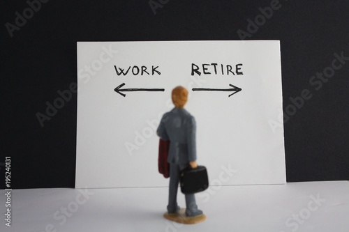Man looks to work and retire inscription with arrows. Retirement concept.