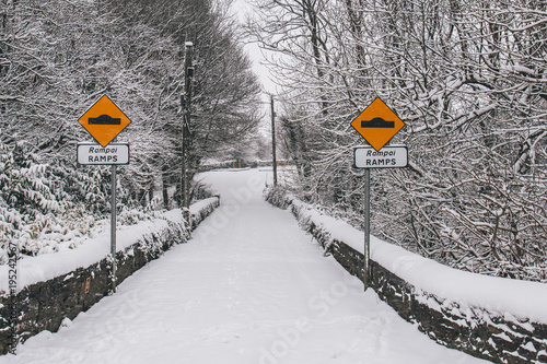 Принти на полотні Irish village during Storm Emma, also known as the Beast from the East, which hit Ireland in the beginning of March: ramps traffic sign