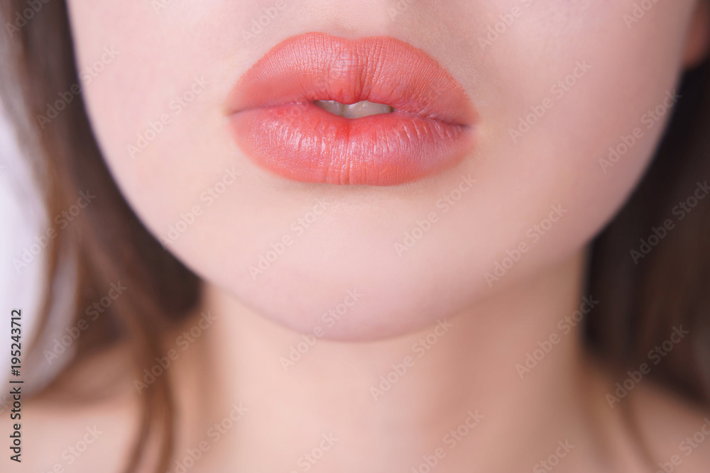 Obraz premium Beautiful woman lips. Lip filling injections, make up, beauty and cosmetic concept