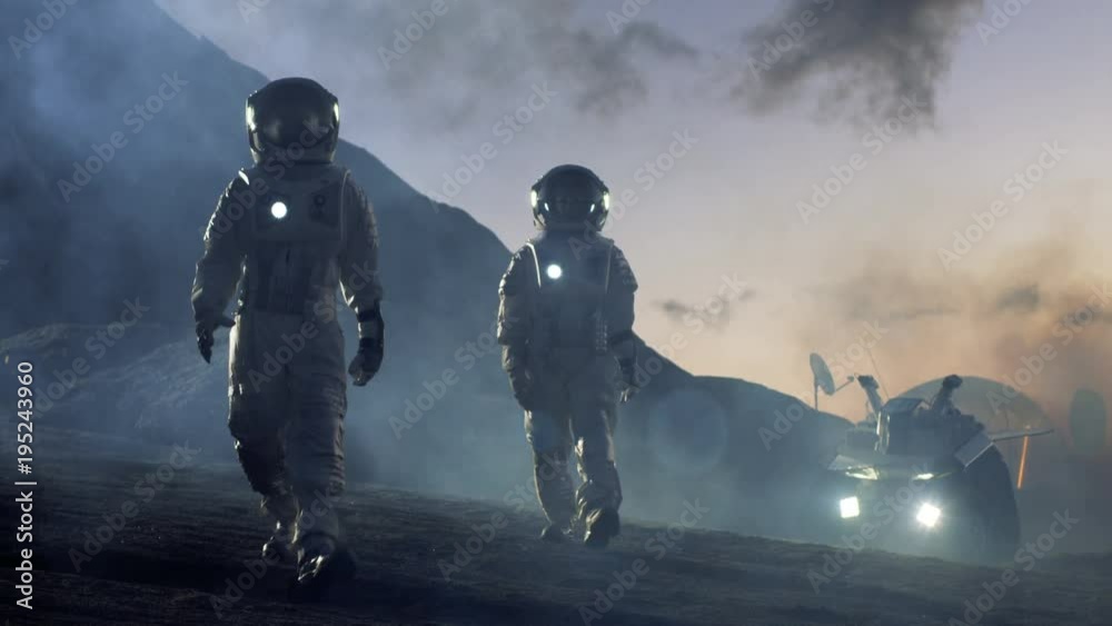 Two Astronauts in Space Suits Confidently Walking on Alien Planet, Exploration of the the Planet's Surface. Shot on RED EPIC-W 8K Helium Cinema Camera.