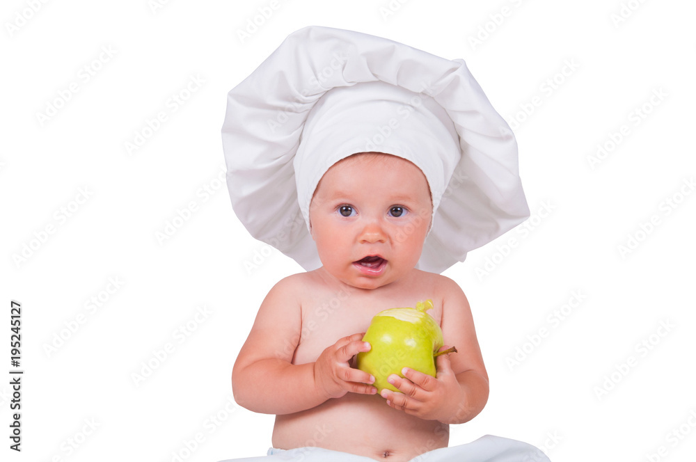 Cheerful little child with apples in hands in a chef suit on a white background. Cheerful little child with apples in hands in a chef suit on a white background.