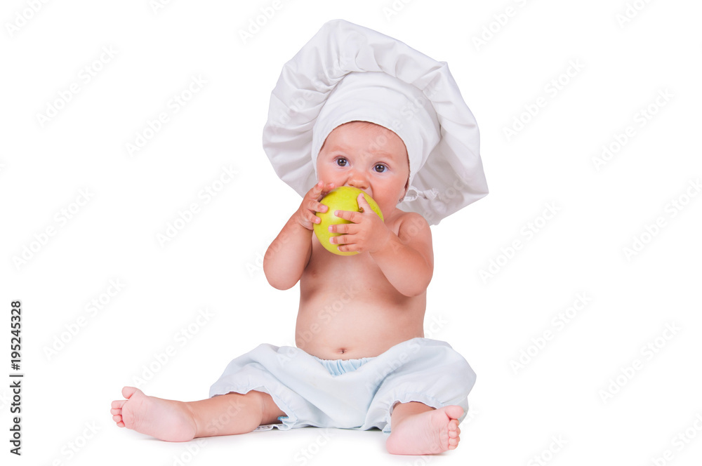 Cheerful little child with apples in hands in a chef suit on a white background. Cheerful little child with apples in hands in a chef suit on a white background.