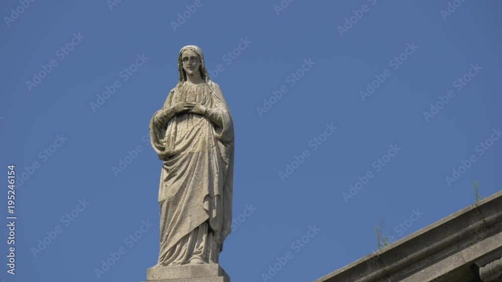 A statue of Virgin Mary on a building