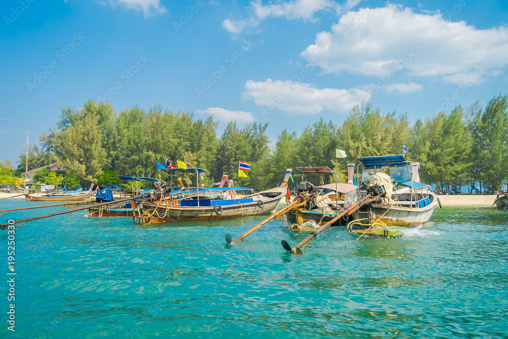 Outdoor view of Fishing thai boats in a row in Po-da island, Krabi Province, Andaman Sea, South of Thailand