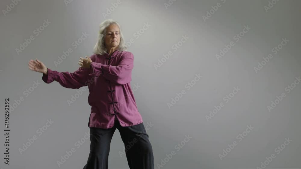Senior woman doing Tai Chi Senior woman doing Tai Chi