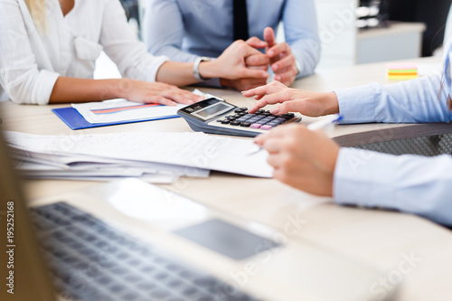 Young couple purchasing shares on the stock exchange photo