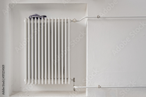 purple winter hat on a white heater