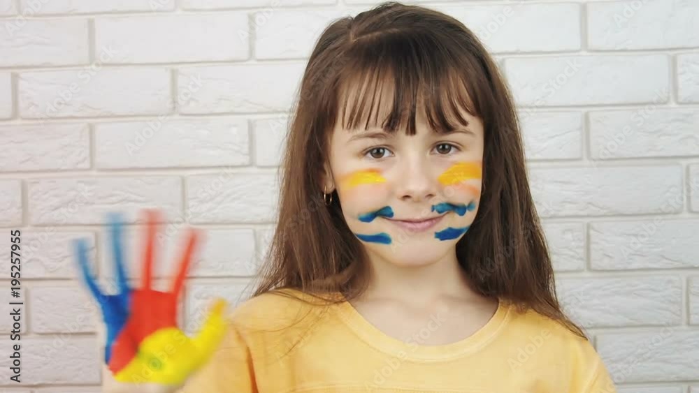 Child in paint. Happy little girl in paint. Child in paint. Happy little girl in paint.