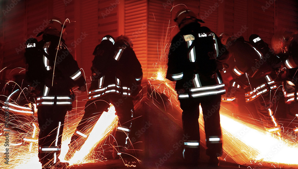 Fototapeta premium 911 rescuers or firefighters at night