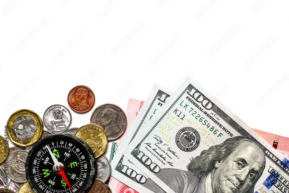 Group of US dollar, Thai bath and other currency cash money coin and banknotes paper in financial payment system with different values and black compass on white background Group of US dollar, Thai bath and other currency cash money coin and banknotes paper in financial payment system with different values and black compass on white background