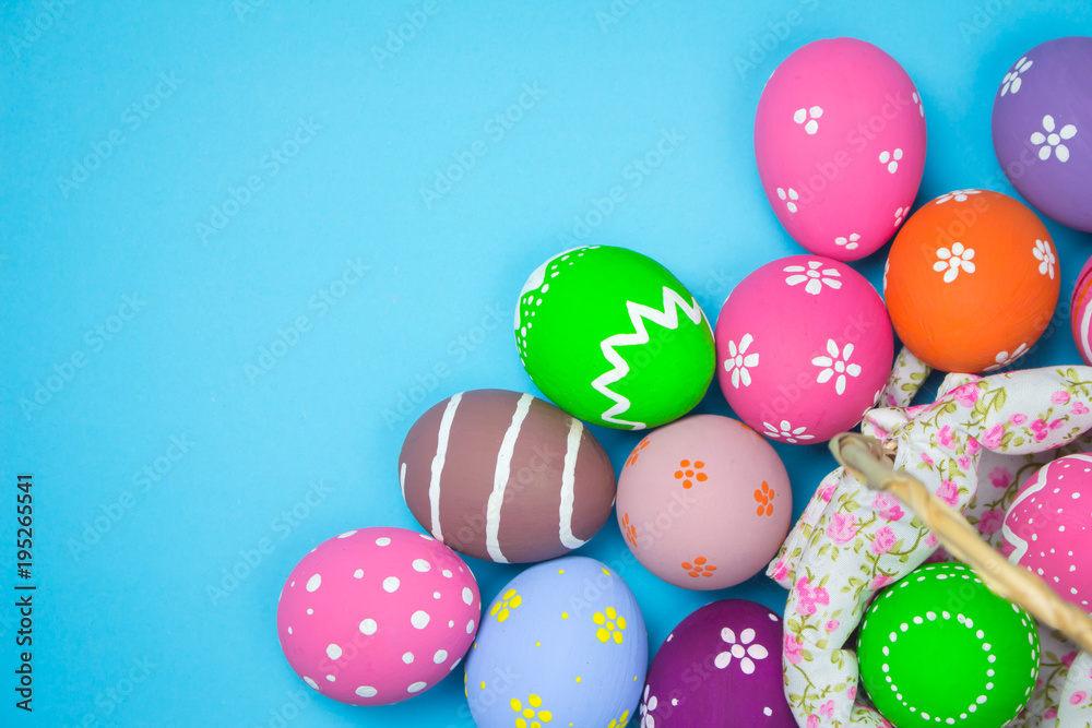 Easter eggs in a basket weave wood on the sky background. Easter eggs in a basket weave wood on the sky background.