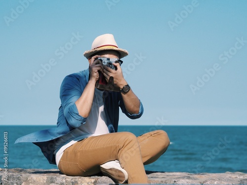 Young traveler man on the beach. © Mallika