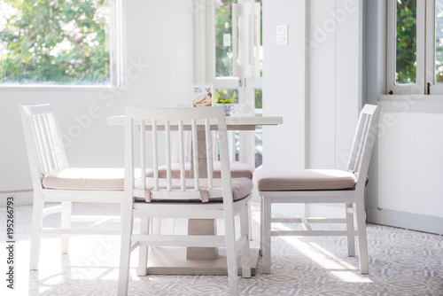 Modern white table and chair set in a cafe