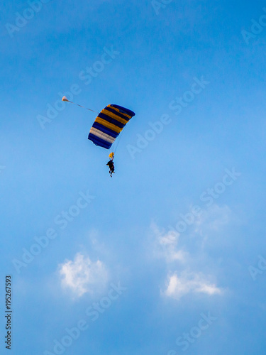 Skydiver with colorful parachute