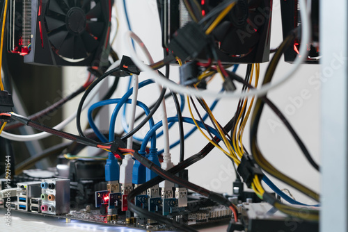 open rack for cryptocurrency mining includes graphics cards, motherboard and hard drive