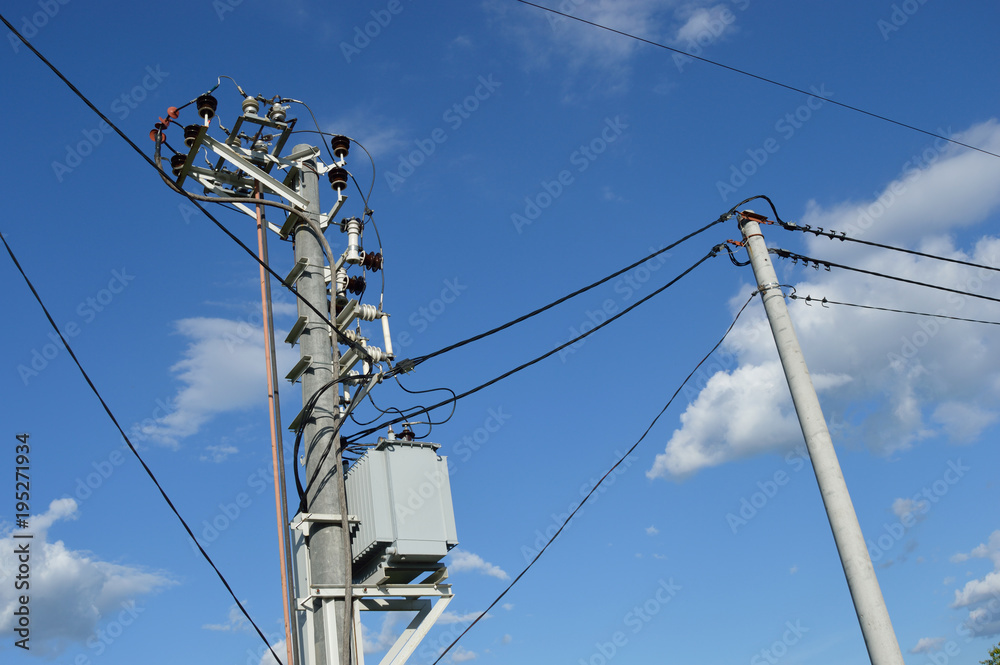 Fototapeta premium Electric power line poles with transformer and wires