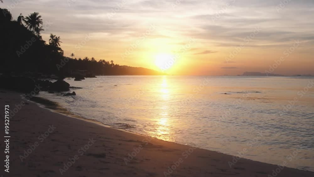 Tropical sandy beach on beautiful sunset on the background. slow motion. 3840x2160 Tropical sandy beach on beautiful sunset on the background. slow motion. 3840x2160