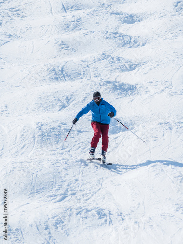 People are enjoying mogul skiing snow boarding