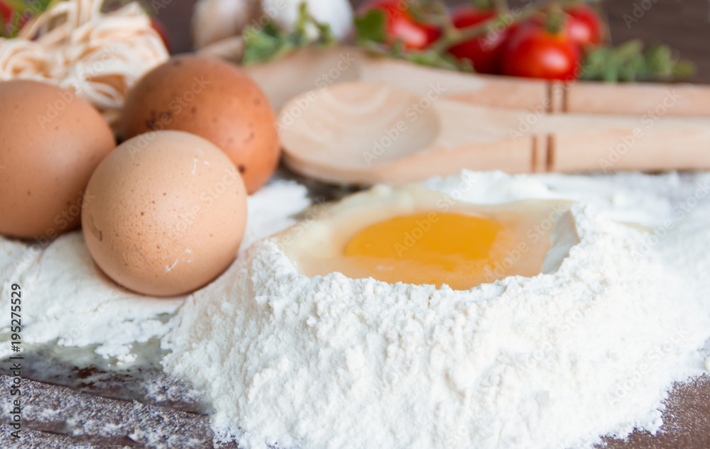 ingredients preparation spaghetti with eggs, tomatoes herbs and spices ingredients preparation spaghetti with eggs, tomatoes herbs and spices