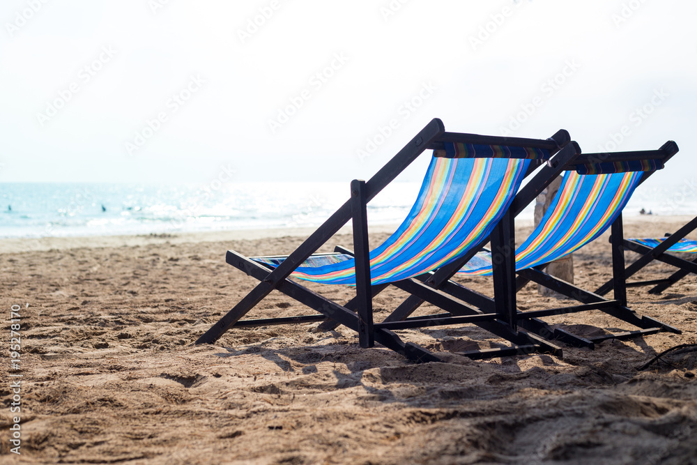 Two beach chair on the beach at sunset. Two beach chair on the beach at sunset.