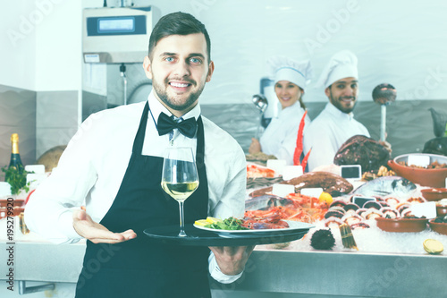 Waiter standing in fish restaurant