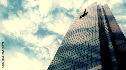 Buildings, fast moving clouds.