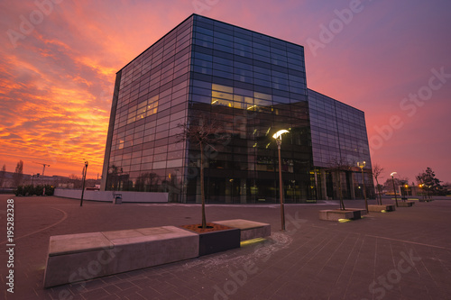 Modern office building during a fiery sunrise