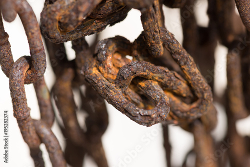 Old tangled weathered chains close up