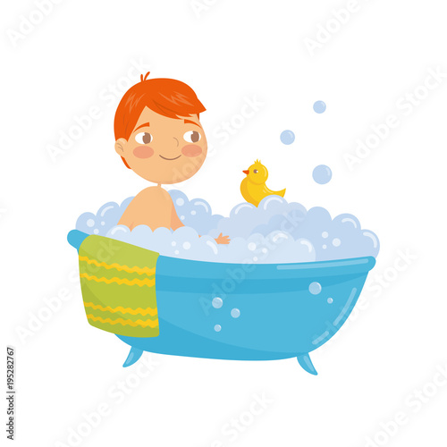 Funny red-haired boy taking bath with rubber duck toy. Bathtub with foam bubbles inside. Daily hygiene. Cartoon character of little child. Colorful flat vector design
