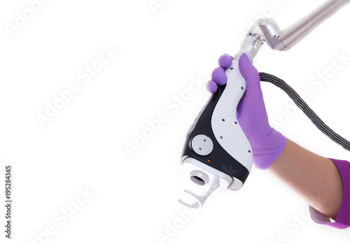 laser skin resurfacing machine in hands. photo