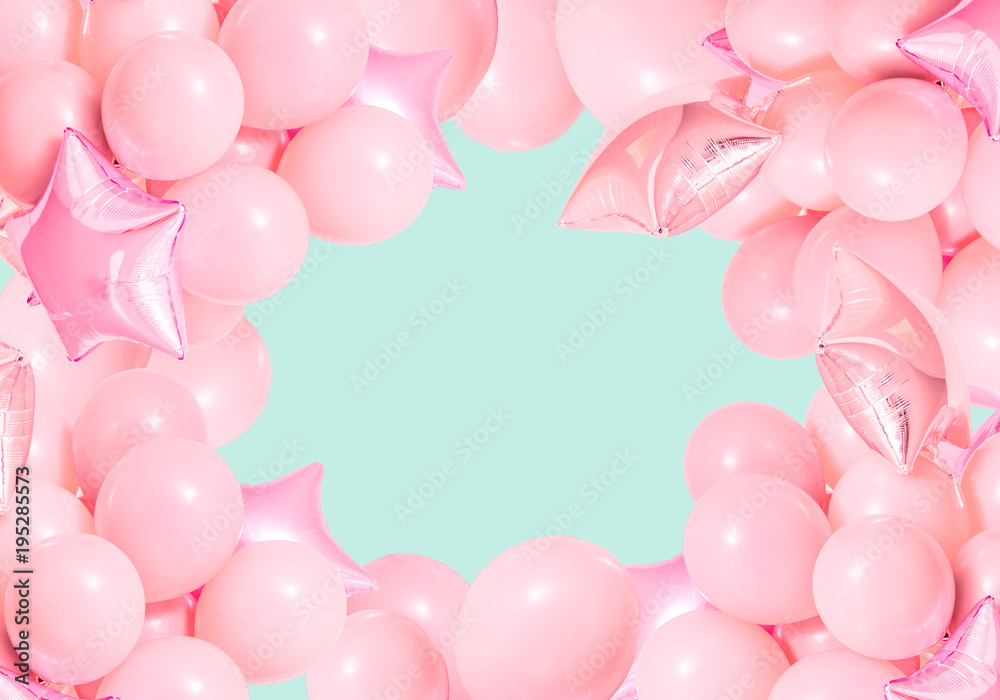 Pink birthday air balloons on mint background
