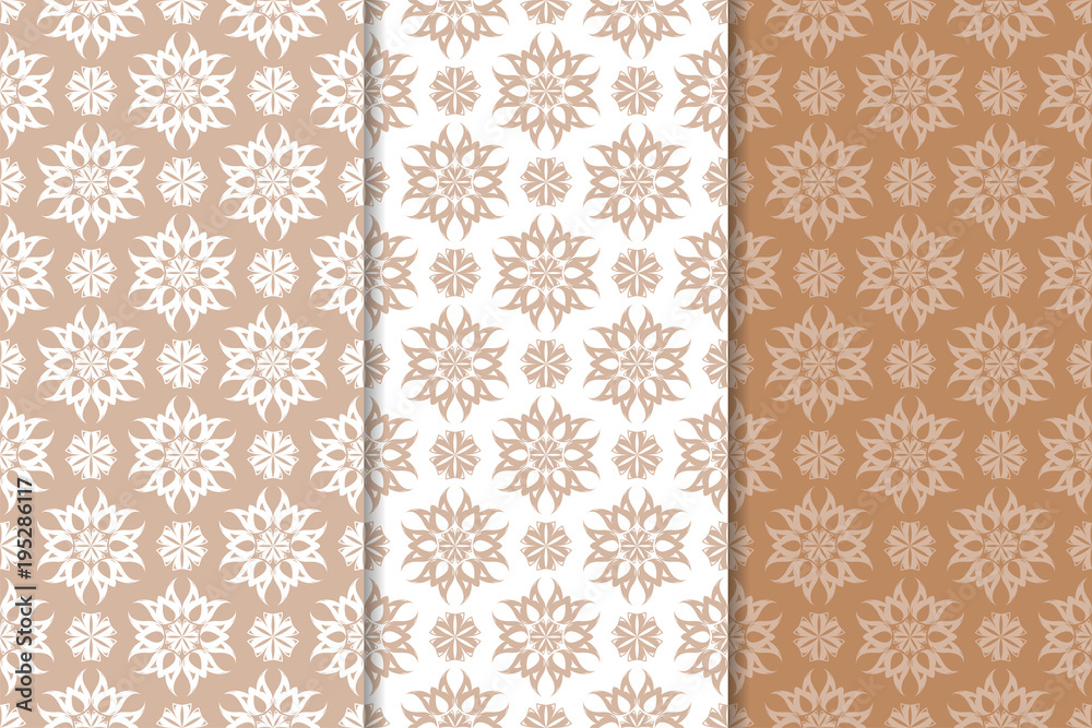 Brown floral ornaments. Set of seamless backgrounds Brown floral ornaments. Set of seamless backgrounds