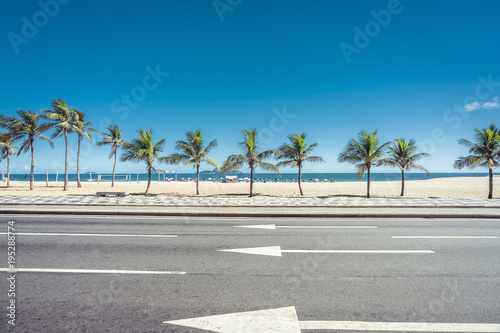Sunny summer day with Palms on Ipanema Beach, Rio de Janeiro, Brazil.